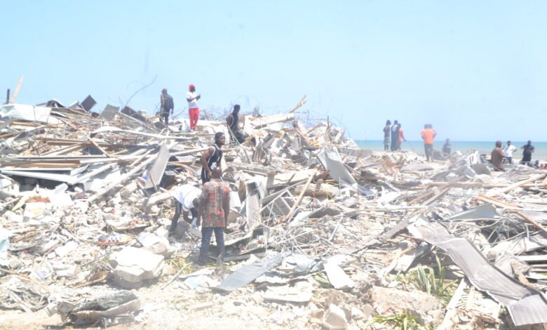 Some victims salveging their belongings after the demolitioning exercise at the Laboma Beach Resort Photo Victor A. Buxton