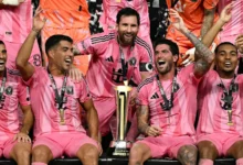 Lionel Messi (middle) celebrates with teammates