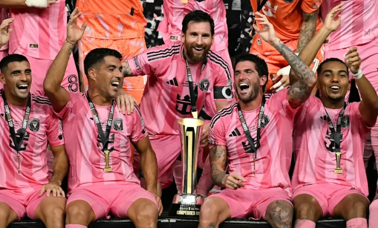 Lionel Messi (middle) celebrates with teammates