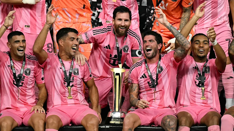 Lionel Messi (middle) celebrates with teammates