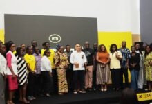 Prof. Nana Aba Appiah Amfo (seventh from left) with MTN staff, and UG staff and students at the partnership ceremony