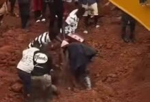 Some miners being removed from the collapsed pit