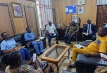 Mr Abudu interacting with SIF staff during the visit