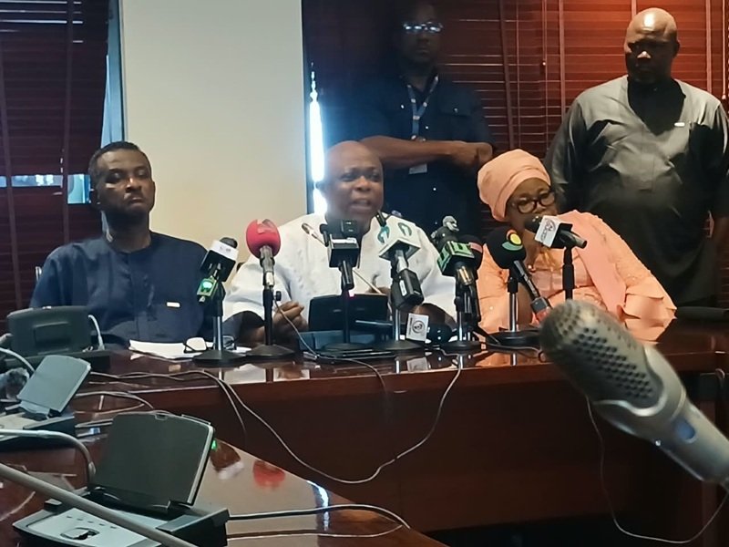 Mr Agalga (middle) speaking at the press briefing