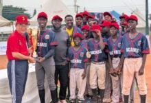 Mr Yoshimoto presenting the winner’s trophy to the players and official of Macabes