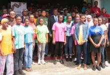 Mr. Nartey George (middle) with some beneficiaries of the Girls in ICT initiative