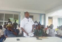 Dr Glate (standing) speaking at the programme,