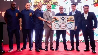 Officials of TCL displaying one of the TCL brands