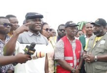 Mr Ahmed Ibrahim briefing the press during his working visit to Kaneshie Market .JPG