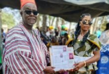 Naa Abdulai Salia (in smock), Chief of Ponyentanga, presenting an award at a durbar