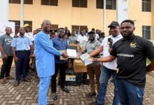 Officials of the bank handing over the items to the school