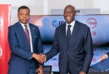 • Dr Botchway (left) in a handshake with Makhtar Diop, Managing Director, IFC