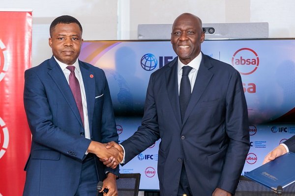 • Dr Botchway (left) in a handshake with Makhtar Diop, Managing Director, IFC