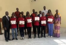 The scholarship beneficiaries with with Rev Dr Dogbe (left) and parents