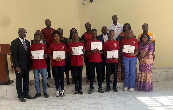 The scholarship beneficiaries with with Rev Dr Dogbe (left) and parents
