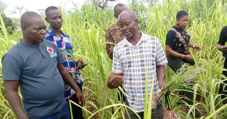 Mr Abentara (right) briefing journalists on the farm