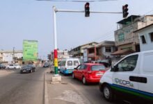 Vehicles crossing red traffic light