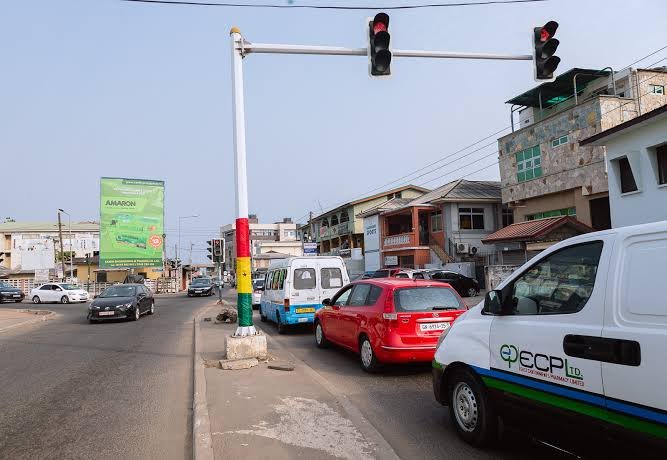 Vehicles crossing red traffic light