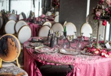 Tablescapes are covered in ash and debris in the aftermath of a fire that broke out in a building hosting a wedding party in Lingwala