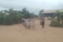 Some pupils standing outside the classrooms