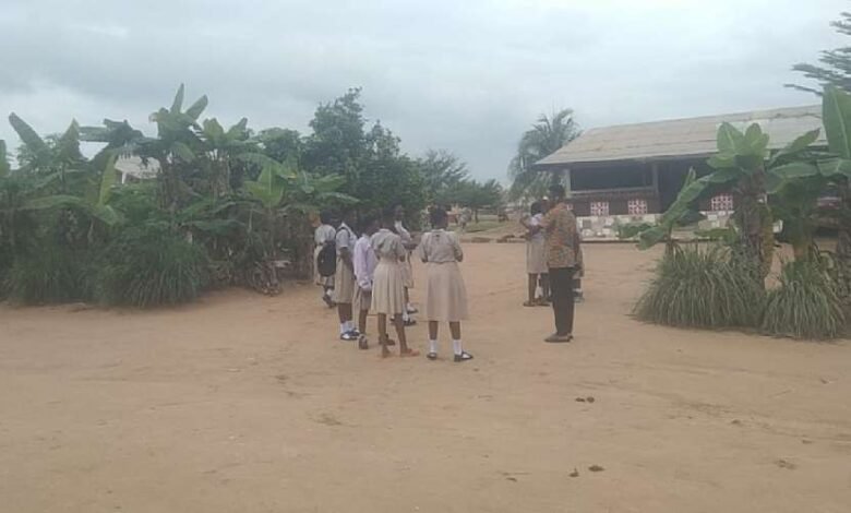 Some pupils standing outside the classrooms
