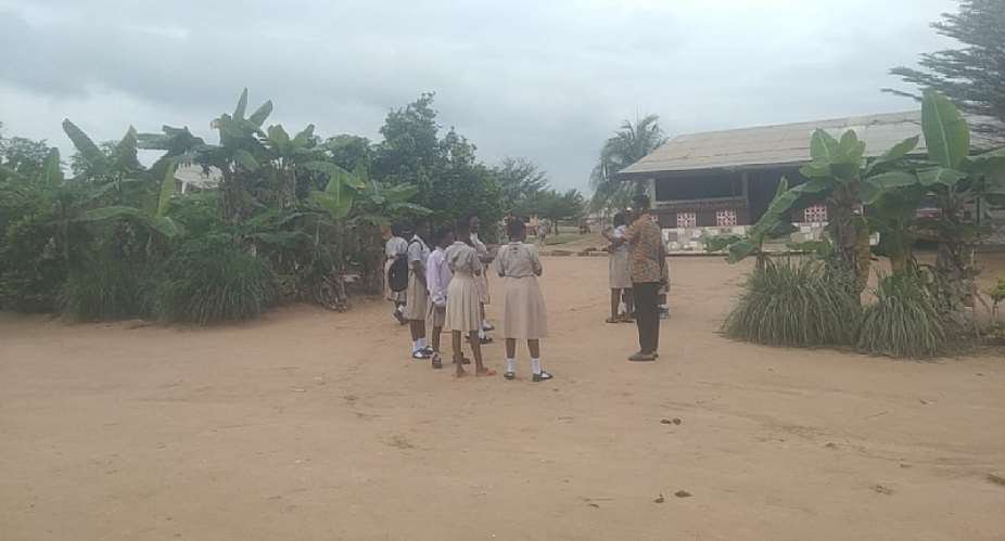 Some pupils standing outside the classrooms