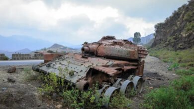 The charred remains of a tank from fighting between the Ethiopian military and the Tigray People’s Liberation Front sit on a road near Gereb Agew in southern Tigray 