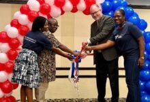 US Embassy hosts k----Mr Oslon (second from right) with other dignitaries cutting the tape to open the fair