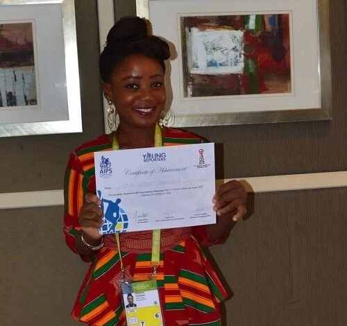 Christine Dzakah displaying her AIPS Young Reporter’s Program Certificate of Achievement
