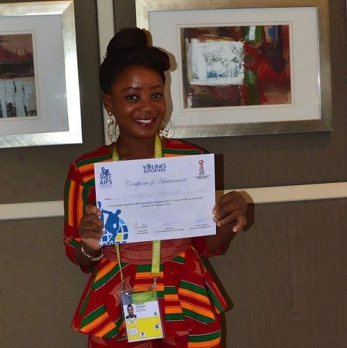 Christine Dzakah displaying her AIPS Young Reporter’s Program Certificate of Achievement