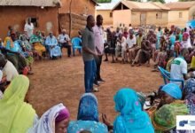 Dr Kwabahson, the Acting Manager of GII at a field engagement with farmers.