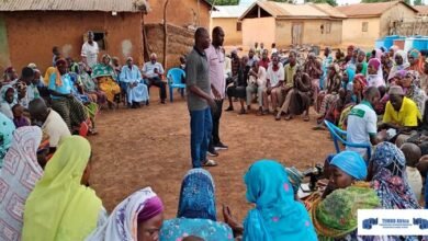Dr Kwabahson, the Acting Manager of GII at a field engagement with farmers.