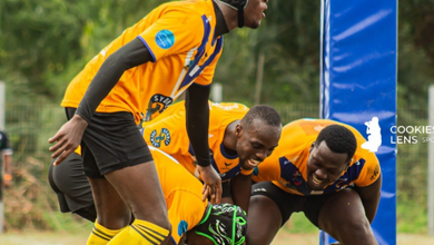 Titans' Papa Sakyi Baidoo (with ball) scores a Try whiles being flanked by teammates