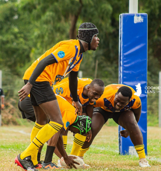 Titans' Papa Sakyi Baidoo (with ball) scores a Try whiles being flanked by teammates
