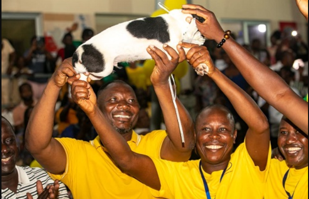 • Mr Bernard Mornah (left), captain of the Dagaaba, displaying the puppy trophy after the event