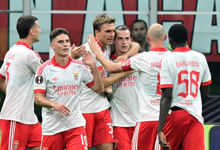 Benfica's Jakub Kaminski celebrates scoring their second goal with teammates