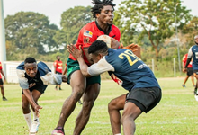 Bulls’ Richard Browne Asare (Red) engages in tackle with Sheihu Tijani of Accra Panthers