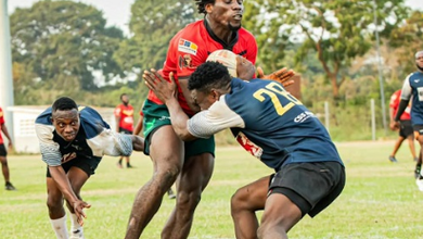 Bulls’ Richard Browne Asare (Red) engages in tackle with Sheihu Tijani of Accra Panthers