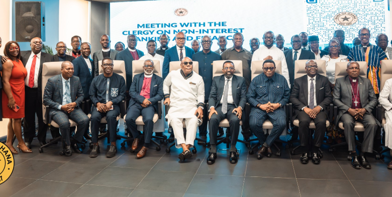 Dr Asiama (seated fifth from left), with Mr Elvis Afriyie Ankrah (seated fifth from right) and other representatives of the various religious groups after the event