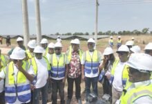 Some members of Parliament’s Select Committee on Energy and Mines at the project site.
