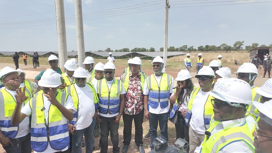 Some members of Parliament’s Select Committee on Energy and Mines at the project site.