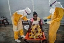 • A team of doctors attending to an Ebola patient