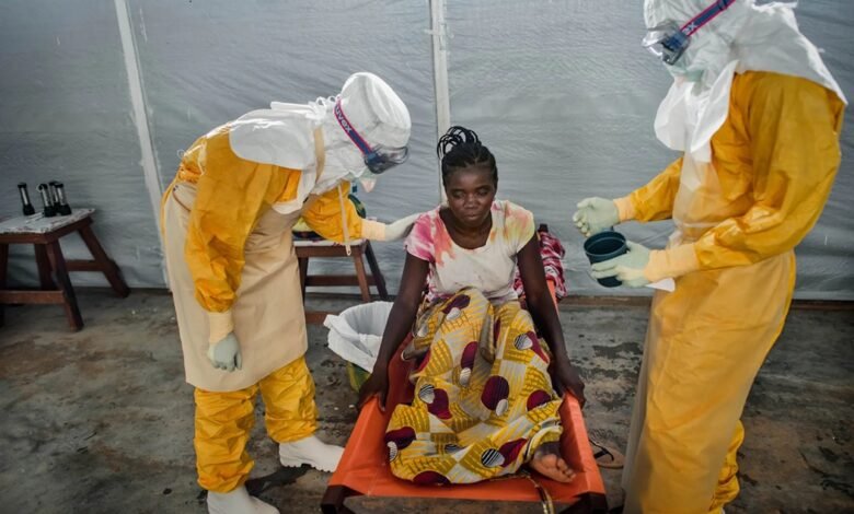 • A team of doctors attending to an Ebola patient