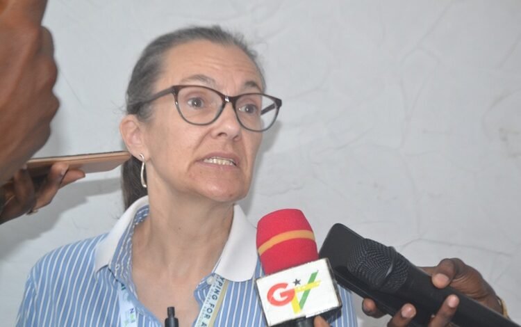 Prof. Jennifer Clarke (inset) speaking at the symposium Photo Victor A. Buxton
