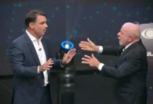 President LuiLula da Silva, right, and right-wing presidential candidate Flavio Bolsonaro speak during a debate in Sao Paulo