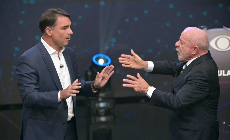 President LuiLula da Silva, right, and right-wing presidential candidate Flavio Bolsonaro speak during a debate in Sao Paulo