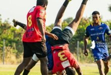 Bulls Captain Martin Oko Buabeng(Red) tackling Godfred Aikins of Nungua Tigers