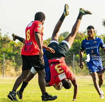 Bulls Captain Martin Oko Buabeng(Red) tackling Godfred Aikins of Nungua Tigers