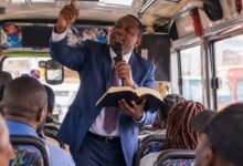 A pastor preaching on a bus