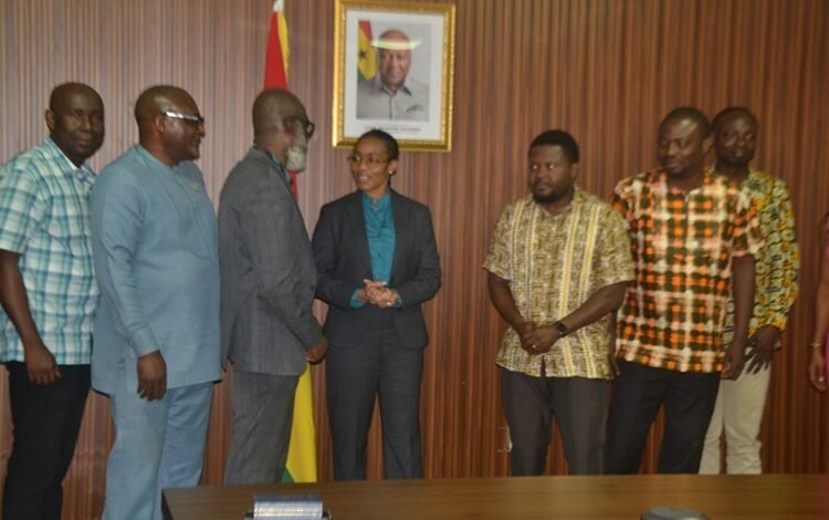 Dr Agyeman-Rawlings (middle) in a chat with Mr Samuel Dampare (third from left) after the event. With them is Dr Tandor (third from right) Photo Victor A. Buxton